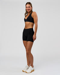 Woman wearing RXD Mid-Rise 6" Short - Black | Model:Amity | Size:S | Thumbnail Index: 7