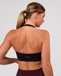 Woman wearing Unleash Sports Bra - Black | Model:Amity | Size:S | Thumbnail Index: 1