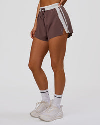 Woman wearing Accelerate 3" Force High-Rise Running Short - Cocoa Powder | Model:Bianca | Size:S | Thumbnail Index: 1