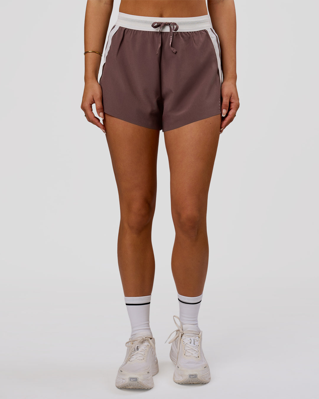 Woman wearing Accelerate 3" Force High-Rise Running Short - Cocoa Powder | Model:Bianca | Size:S - view 3