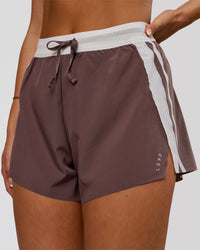 Woman wearing Accelerate 3" Force High-Rise Running Short - Cocoa Powder | Model:Bianca | Size:S | Thumbnail Index: 0