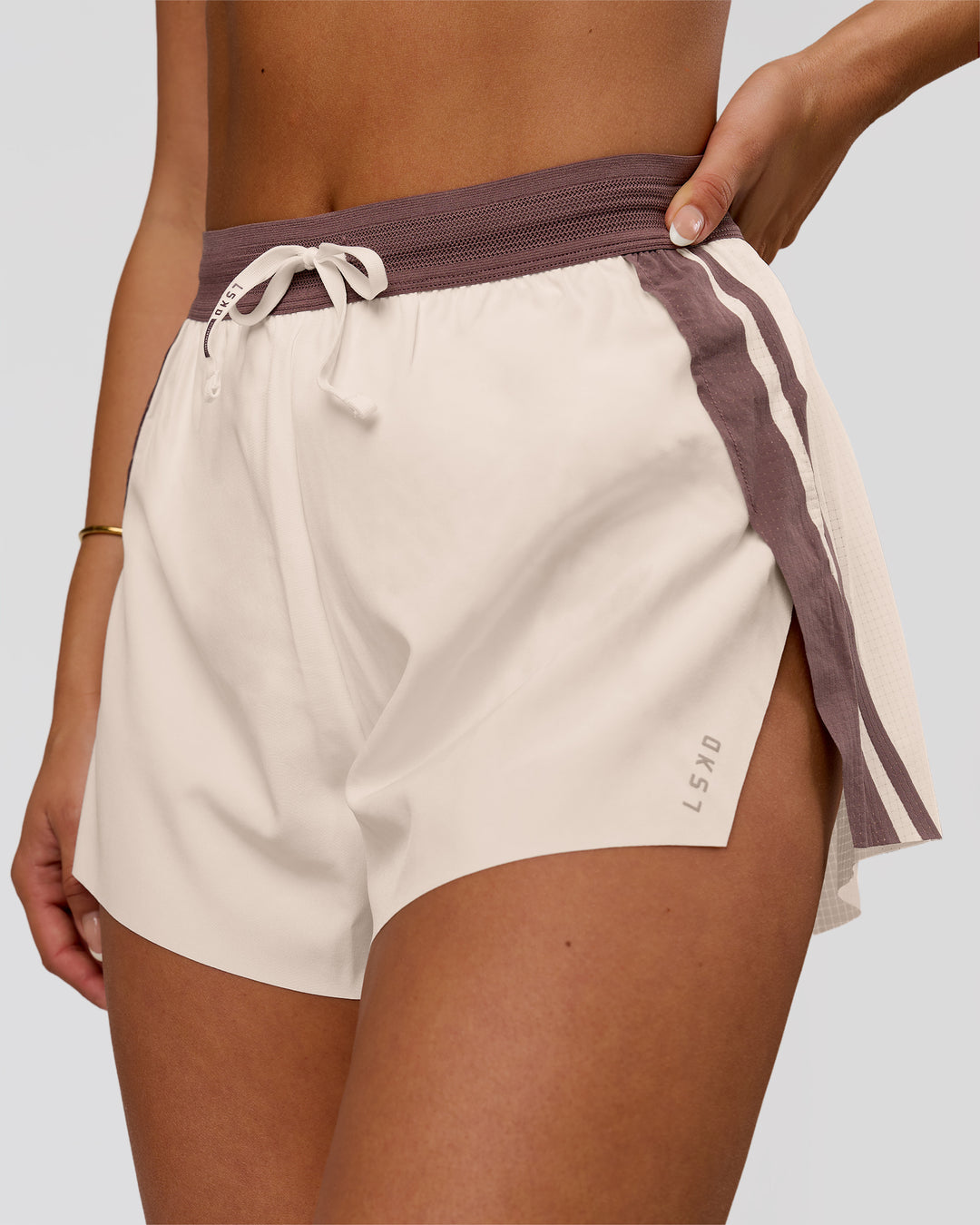 Woman wearing Accelerate 3" Force High-Rise Running Short - Cocoa Powder-Off White | Model:Bianca | Size:S - view 1