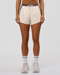 Woman wearing Accelerate 3" Force High-Rise Running Short - Cocoa Powder-Off White | Model:Bianca | Size:S | Thumbnail Index: 2