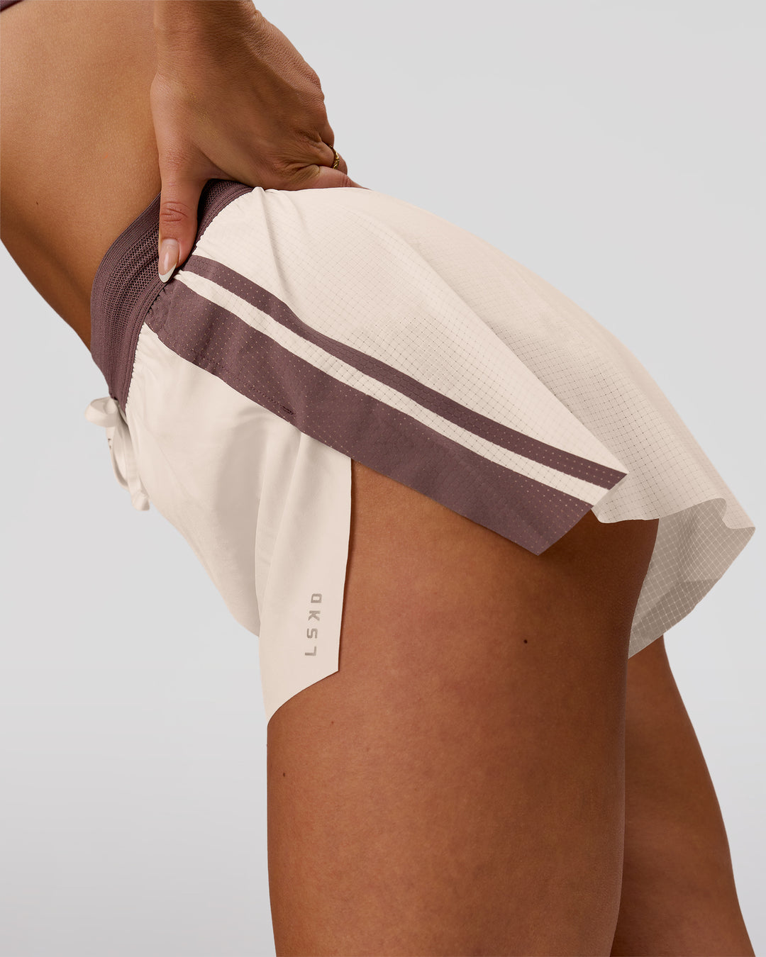 Woman wearing Accelerate 3" Force High-Rise Running Short - Cocoa Powder-Off White | Model:Bianca | Size:S - view 7