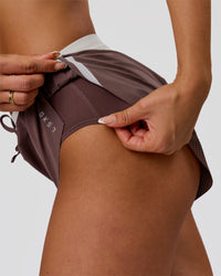Woman wearing Accelerate 3" Force Mid-Rise Running Short - Cocoa Powder | Model:Bianca | Size:S | Thumbnail Index: 1