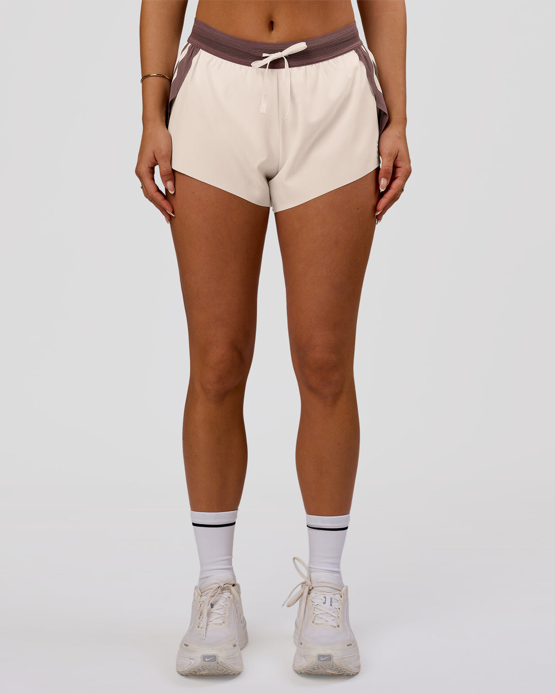 Woman wearing Accelerate 3" Force Mid-Rise Running Short - Cocoa powder-Off White | Model:Bianca | Size:S - view 4