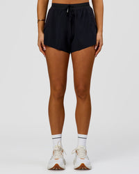Woman wearing Accelerate 3" High-Rise Running Short - Black | Model:Bianca | Size:S