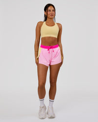 Woman wearing Accelerate 3" High-Rise Running Short - Marshmallow-Lemon-Ultra Pink | Model:Bianca | Size:S | Thumbnail Index: 1