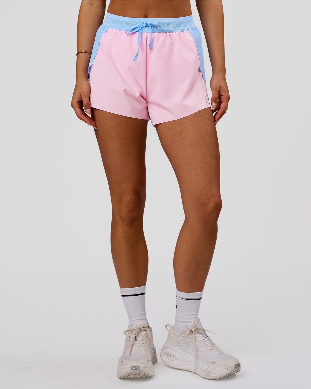 Woman wearing Accelerate 3" High-Rise Running Short - Open Air-Marshmallow | Model:Bianca | Size:S - view 4
