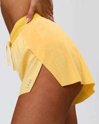 Woman wearing Accelerate 3" High-Rise Running Short - Sunbeam-Lemon | Model:Bianca | Size:S | Thumbnail Index: 0
