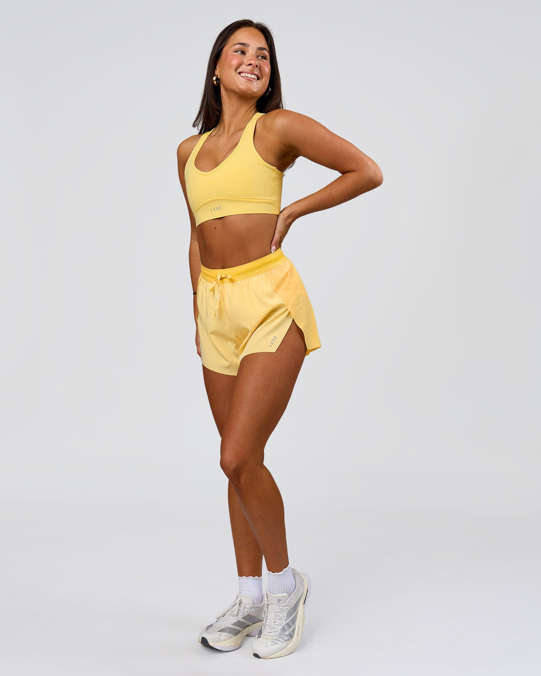Woman wearing Accelerate 3" High-Rise Running Short - Sunbeam-Lemon | Model:Bianca | Size:S - view 3