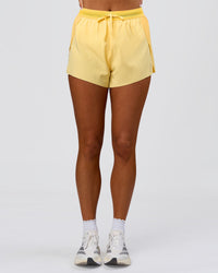 Woman wearing Accelerate 3" High-Rise Running Short - Sunbeam-Lemon | Model:Bianca | Size:S | Thumbnail Index: 3