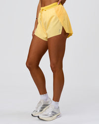 Woman wearing Accelerate 3" High-Rise Running Short - Sunbeam-Lemon | Model:Bianca | Size:S | Thumbnail Index: 7