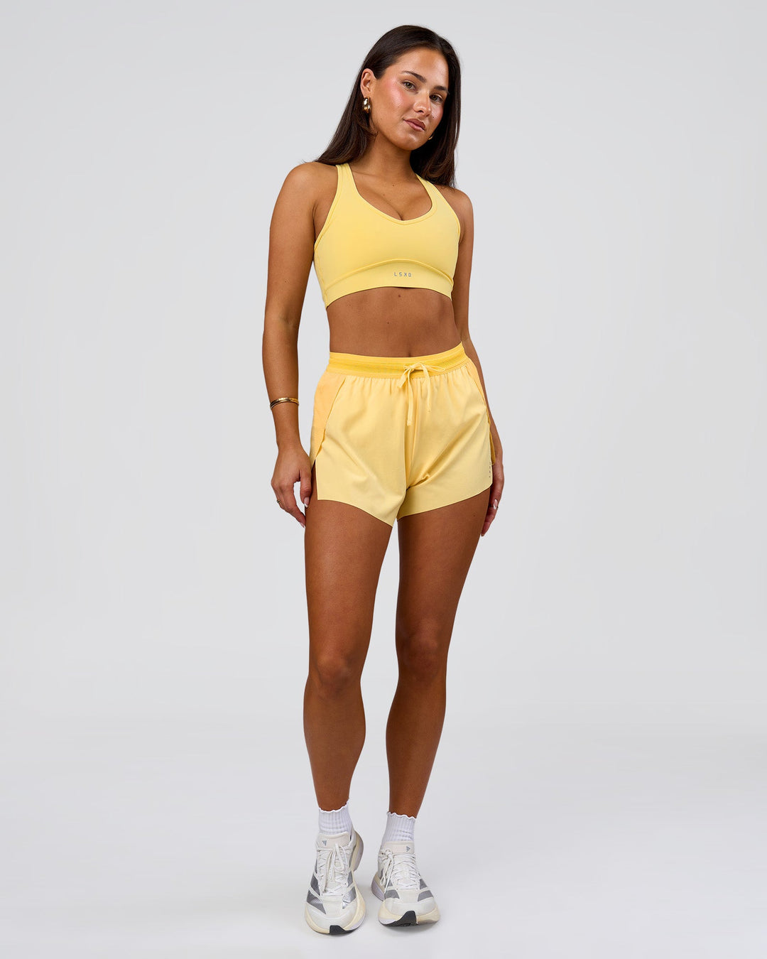 Woman wearing Accelerate 3" High-Rise Running Short - Sunbeam-Lemon | Model:Bianca | Size:S - view 9