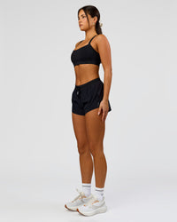 Woman wearing Accelerate 3" Mid-Rise Running Short - Black | Model:Bianca | Size:S