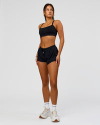 Woman wearing Accelerate 3" Mid-Rise Running Short - Black | Model:Bianca | Size:S
