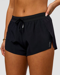 Woman wearing Accelerate 3" Mid-Rise Running Short - Black | Model:Bianca | Size:S