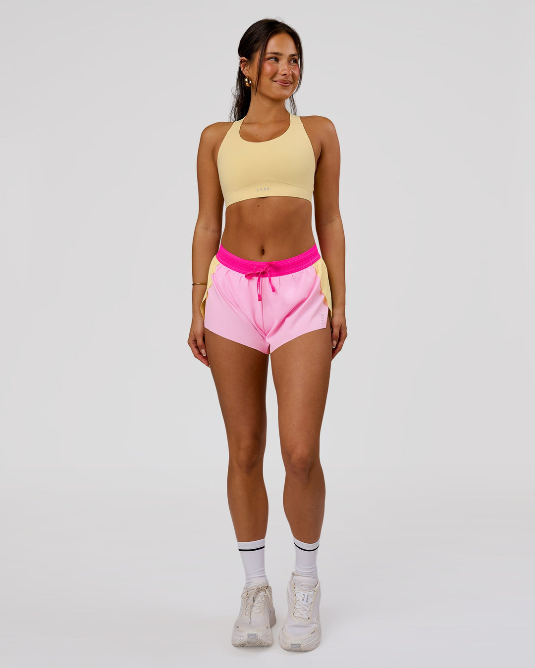 Woman wearing Accelerate 3" Mid-Rise Running Short - Marshmallow-Lemon-Ultra Pink | Model:Bianca | Size:S - view 2