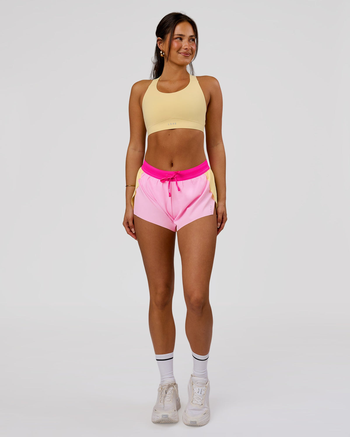 Woman wearing Accelerate 3" Mid-Rise Running Short - Marshmallow-Lemon-Ultra Pink | Model:Bianca | Size:S - view 2