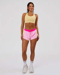 Woman wearing Accelerate 3" Mid-Rise Running Short - Marshmallow-Lemon-Ultra Pink | Model:Bianca | Size:S | Thumbnail Index: 4