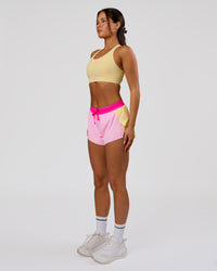 Woman wearing Accelerate 3" Mid-Rise Running Short - Marshmallow-Lemon-Ultra Pink | Model:Bianca | Size:S | Thumbnail Index: 10