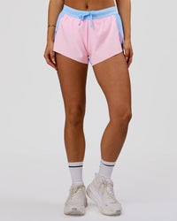 Woman wearing Accelerate 3" Mid-Rise Running Short - Open Air-Marshmallow | Model:Bianca | Size:S | Thumbnail Index: 1