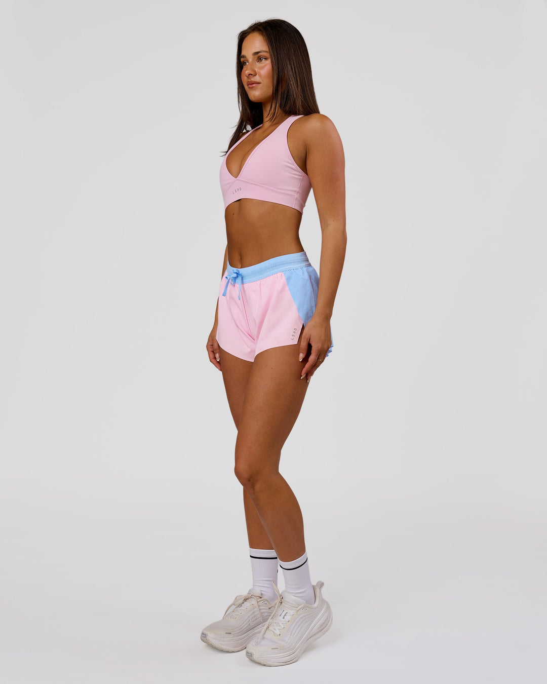 Woman wearing Accelerate 3" Mid-Rise Running Short - Open Air-Marshmallow | Model:Bianca | Size:S - view 3