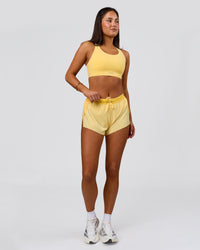 Woman wearing Accelerate 3" Mid-Rise Running Short - Sunbeam-Lemon | Model:Bianca | Size:S | Thumbnail Index: 3