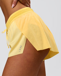 Woman wearing Accelerate 3" Mid-Rise Running Short - Sunbeam-Lemon | Model:Bianca | Size:S | Thumbnail Index: 6