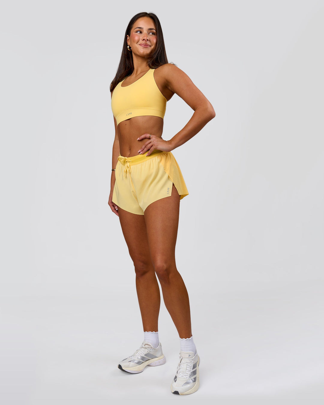Woman wearing Accelerate 3" Mid-Rise Running Short - Sunbeam-Lemon | Model:Bianca | Size:S - view 11