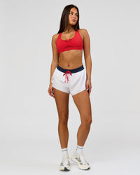 Woman wearing Accelerate 3" Mid-Rise Running Short - White-Future Navy | Model:Bianca | Size:S | Thumbnail Index: 4