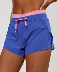 Woman wearing Accelerate Synergy 3" Running Short Short - Power Cobalt-Pink Rose | Model:Bianca | Size:S | Thumbnail Index: 1