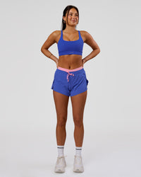 Woman wearing Accelerate Synergy 3" Running Short Short - Power Cobalt-Pink Rose | Model:Bianca | Size:S | Thumbnail Index: 10