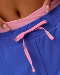 Woman wearing Accelerate Synergy 3" Running Short Short - Power Cobalt-Pink Rose | Model:Bianca | Size:S | Thumbnail Index: 12