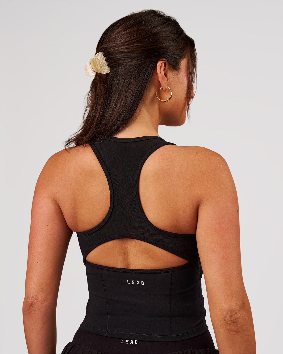 Woman wearing Aura Mesh Shelf Bra Tank - Black | Model:Bianca | Size:S - view 2