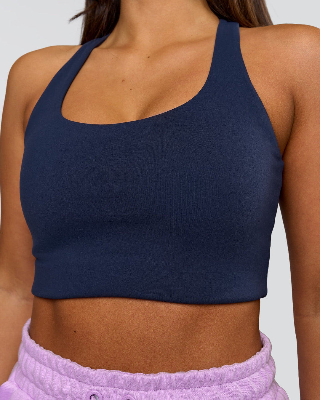 Woman wearing Flow Long Line Sports Bra - Future Navy | Model:Bianca | Size:S - view 1