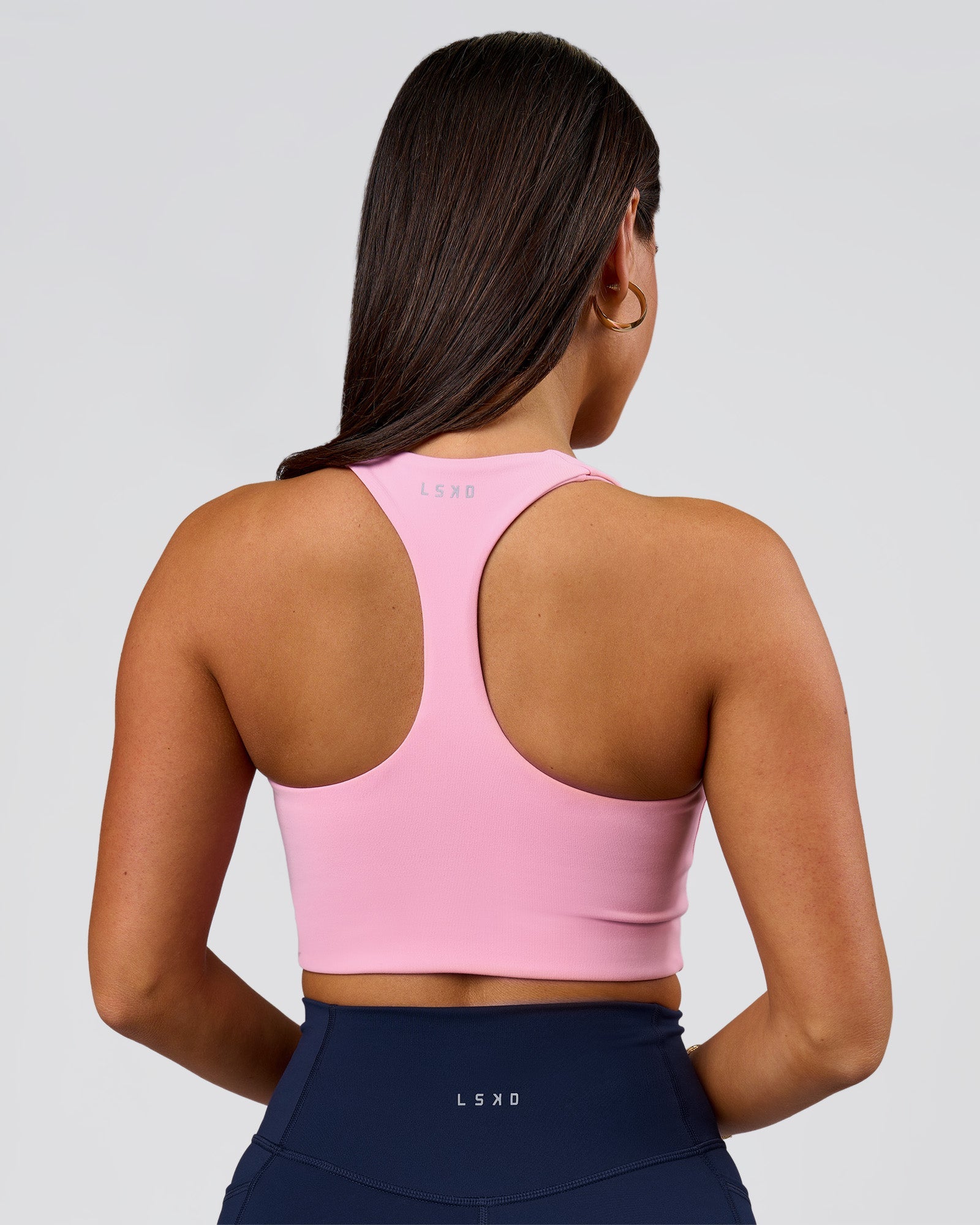Woman wearing Flow Long Line Sports Bra - Pink Rose | Model:Bianca | Size:S