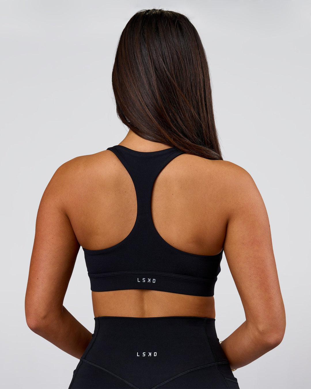 Woman wearing Flow Sports Bra - Black | Model:Bianca | Size:S - view 2