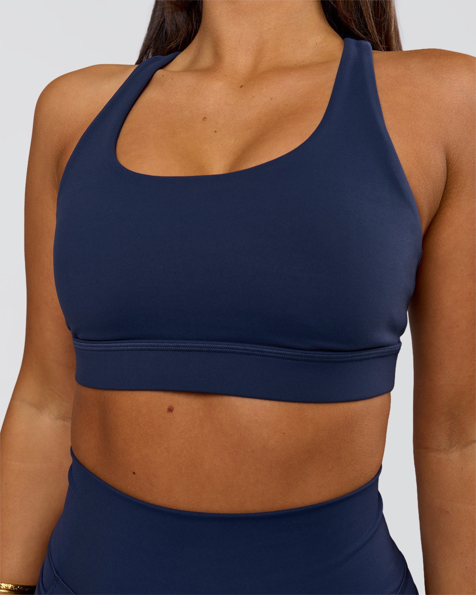 Woman wearing Flow Sports Bra - Future Navy | Model:Bianca | Size:S