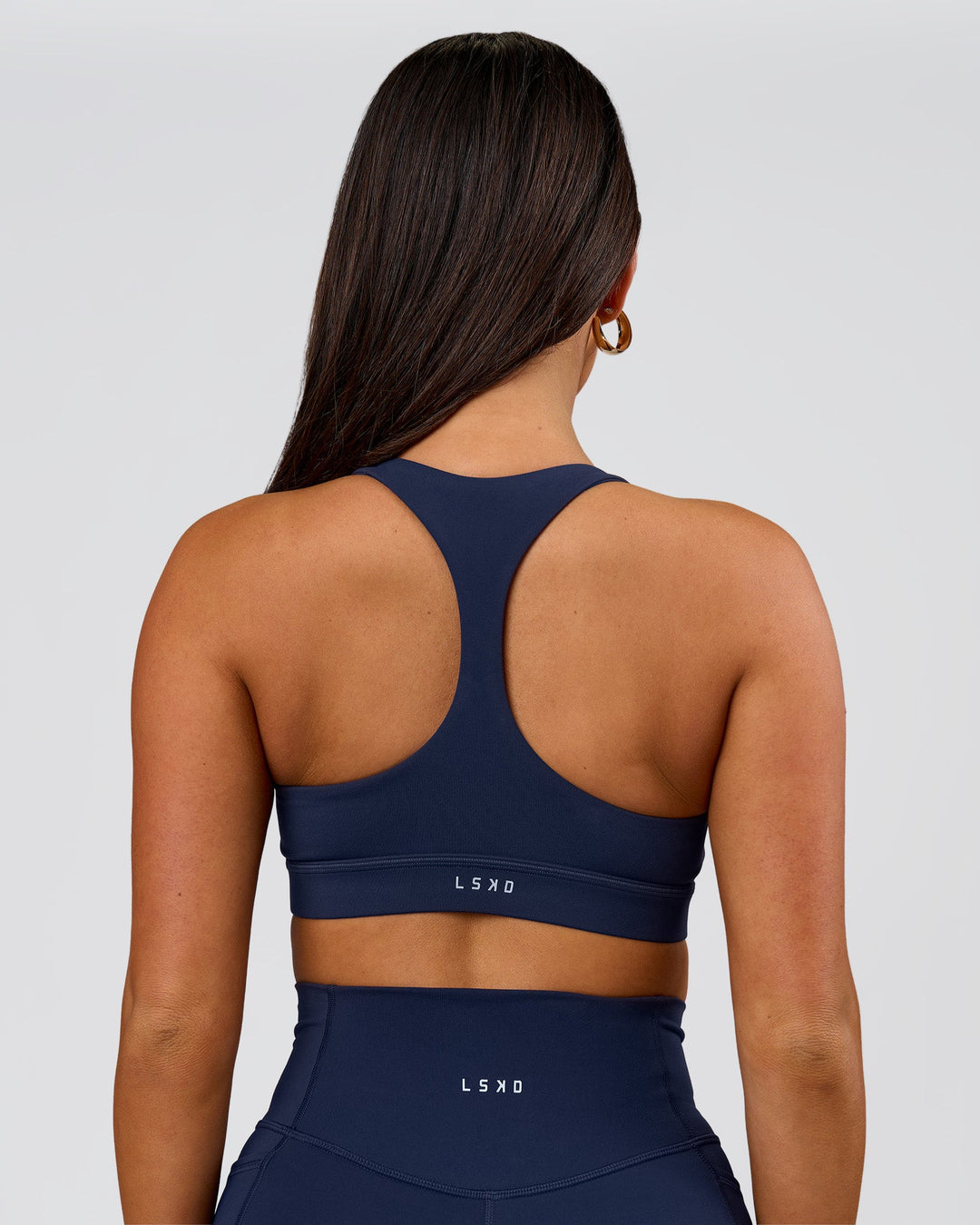 Woman wearing Flow Sports Bra - Future Navy | Model:Bianca | Size:S - view 3