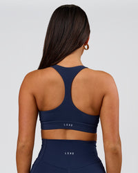 Woman wearing Flow Sports Bra - Future Navy | Model:Bianca | Size:S | Thumbnail Index: 2