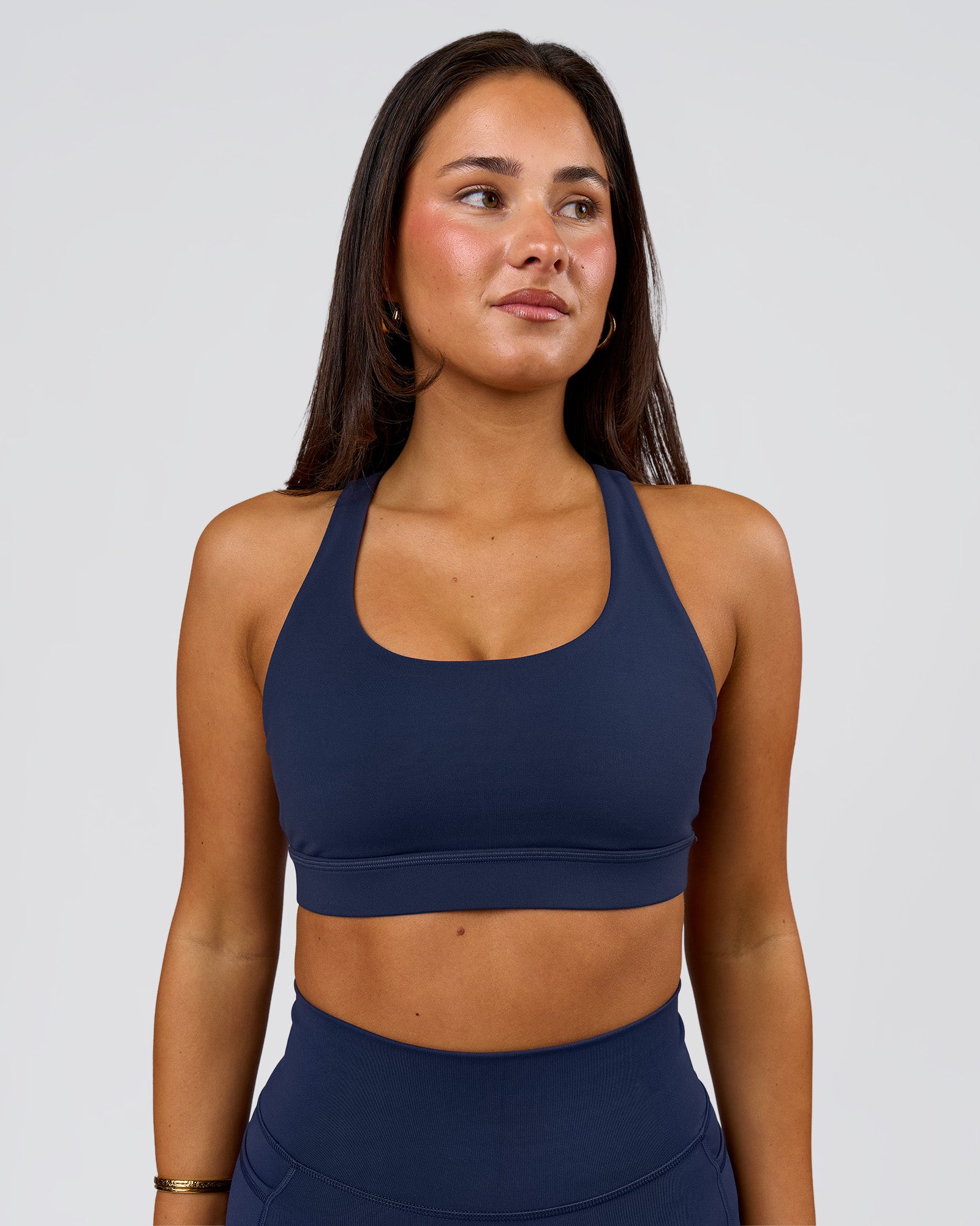 Woman wearing Flow Sports Bra - Future Navy | Model:Bianca | Size:S