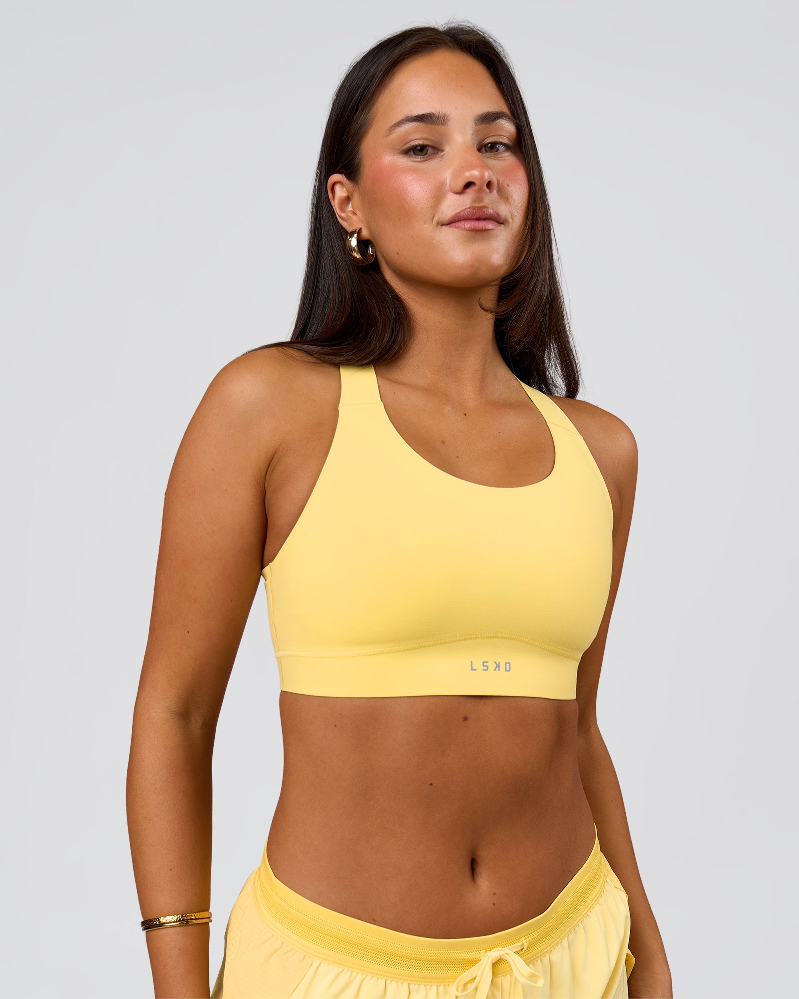Woman wearing Fusion Sports Bra 2.0 - Lemon | Model:Bianca | Size:S