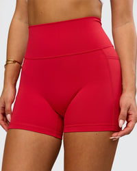 Woman wearing Fusion Ultra High-Rise 4" Short Pockets - Scarlet | Model:Bianca | Size:S | Thumbnail Index: 1
