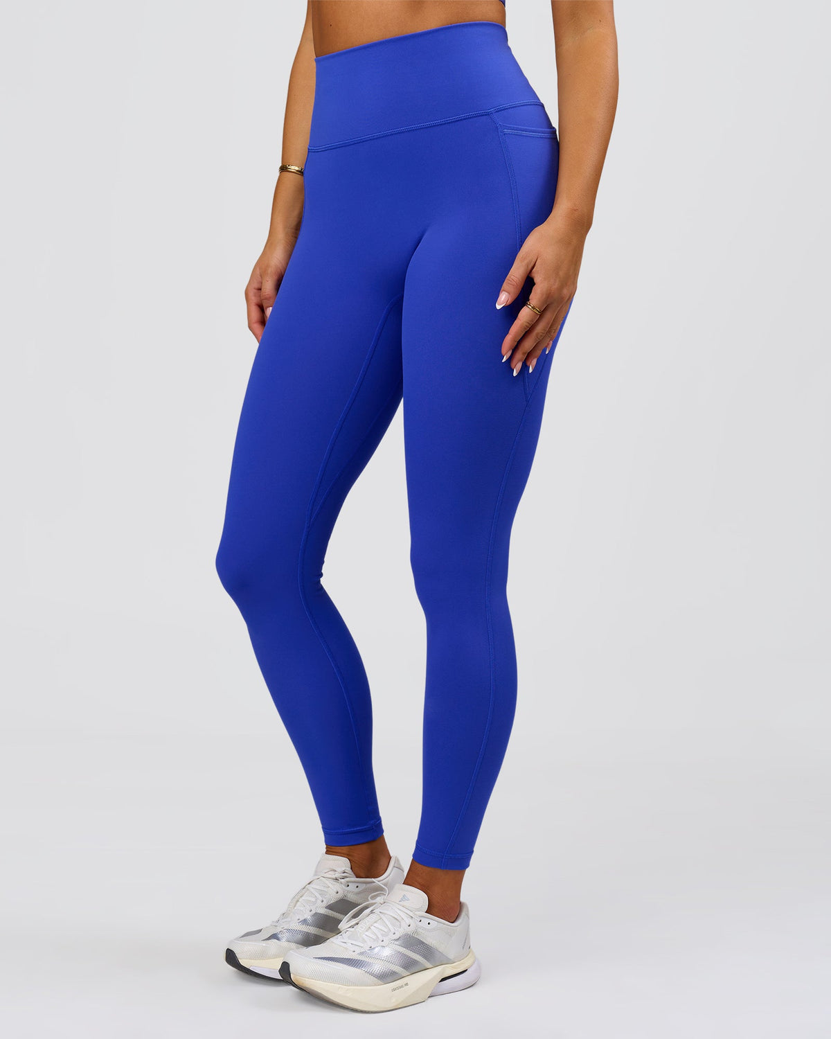 Woman wearing Fusion V-Contour Ultra High-Rise Full Length Legging Pockets - Power Cobalt | Model:Bianca | Size:S