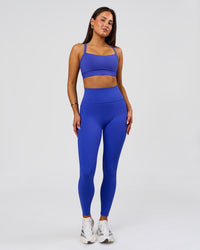 Woman wearing Fusion V-Contour Ultra High-Rise Full Length Legging Pockets - Power Cobalt | Model:Bianca | Size:S | Thumbnail Index: 2