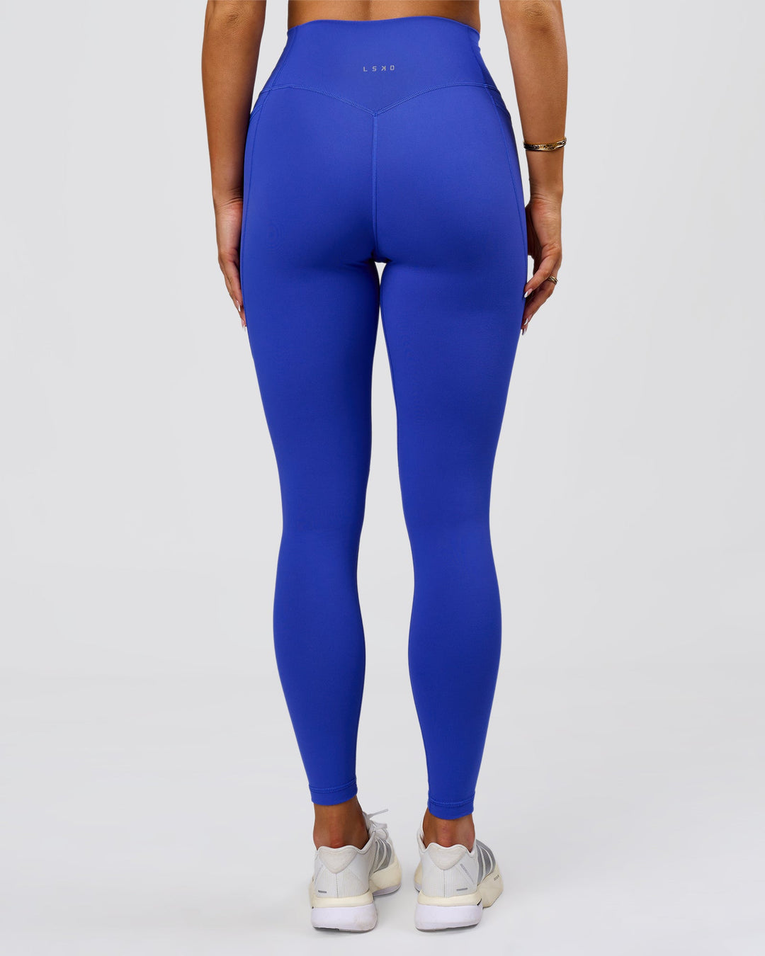 Woman wearing Fusion V-Contour Ultra High-Rise Full Length Legging Pockets - Power Cobalt | Model:Bianca | Size:S - view 6