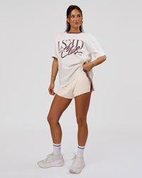 Woman wearing LSKD Fitness Club Heavyweight Oversized Tee - Off White-Cocoa Powder | Model:Bianca | Size:S | Thumbnail Index: 4