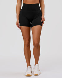 Woman wearing Luxe V-Contour High-Rise 6" Short - Black | Model:Bianca | Size:S | Thumbnail Index: 11
