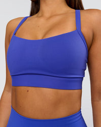 Woman wearing Momentum Sports Bra D/DD/E - Power Cobalt | Model:Bianca | Size:S | Thumbnail Index: 0